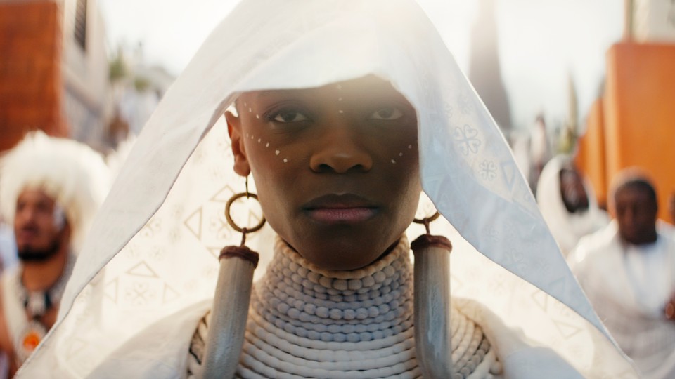 Letitia Wright walking in a funeral procession in "Black Panther: Wakanda Forever"