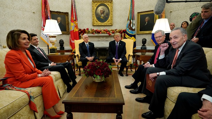 President Trump, Vice President Mike Pence, and congressional leaders seated in the Oval Office.