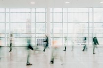 People walking in front of an NYC skyline