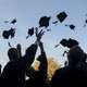 Graduates throwing caps in the air