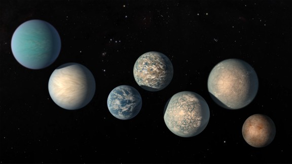 An illustration of the seven planets around a small star 40 light-years from Earth