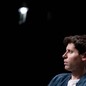 Sam Altman, OpenAI CEO, sits on stage during a meeting
