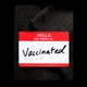 A name tag that reads "vaccinated"