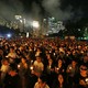 A large crowd of Hong Kong residents participates in a candlelight vigil in Victoria Park, Hong Kong.