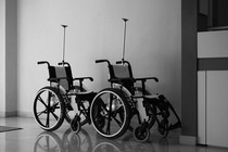 Empty wheelchairs in a health-care setting.