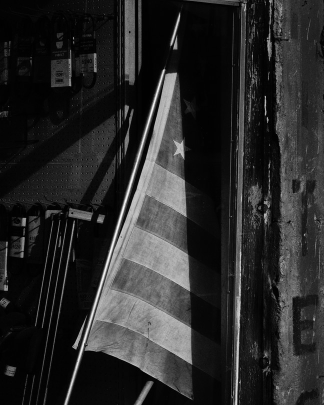 A black-and-white image of an American flag