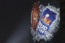 A Super Bowl LIX Bud Light beer ad on the side of building ahead of Super Bowl LIX