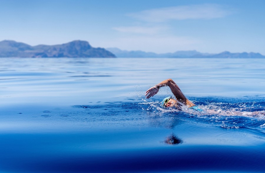 A swimmer is pictured in deep water.