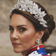 A photograph of Kate Middleton wearing a leafy silver tiara, looking back at the camera over her left shoulder
