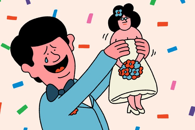 A man adoringly holding up a doll-like version of his wife