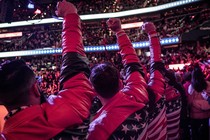 Trump rally-goers raise their fists