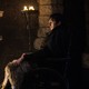 Bran Stark sitting before a fire on 'Game of Thrones'