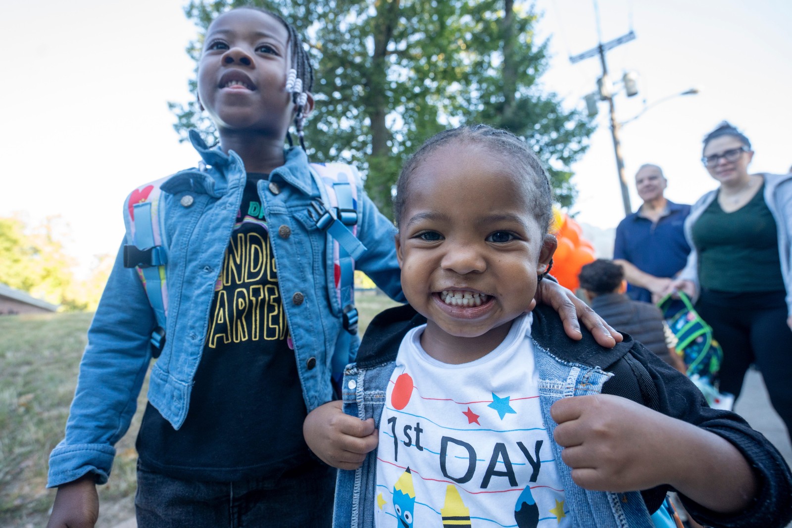 Two young students pose for a photograph on the first day of school.