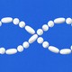 An image of an infinity symbol made of pills