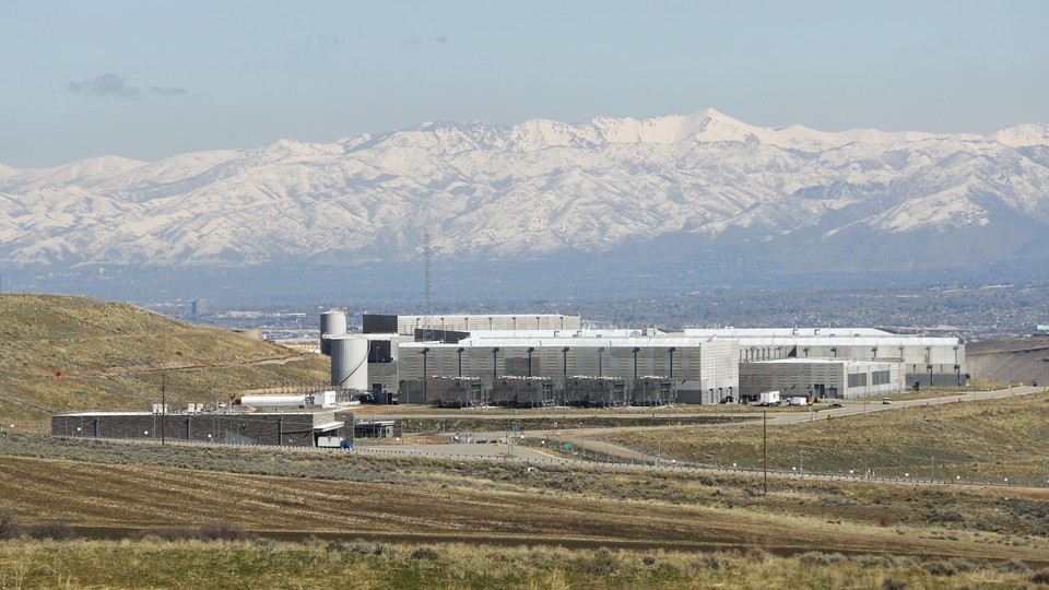 The NSA data center in Bluffdale, Utah, seen from a distance, with mountains in the background