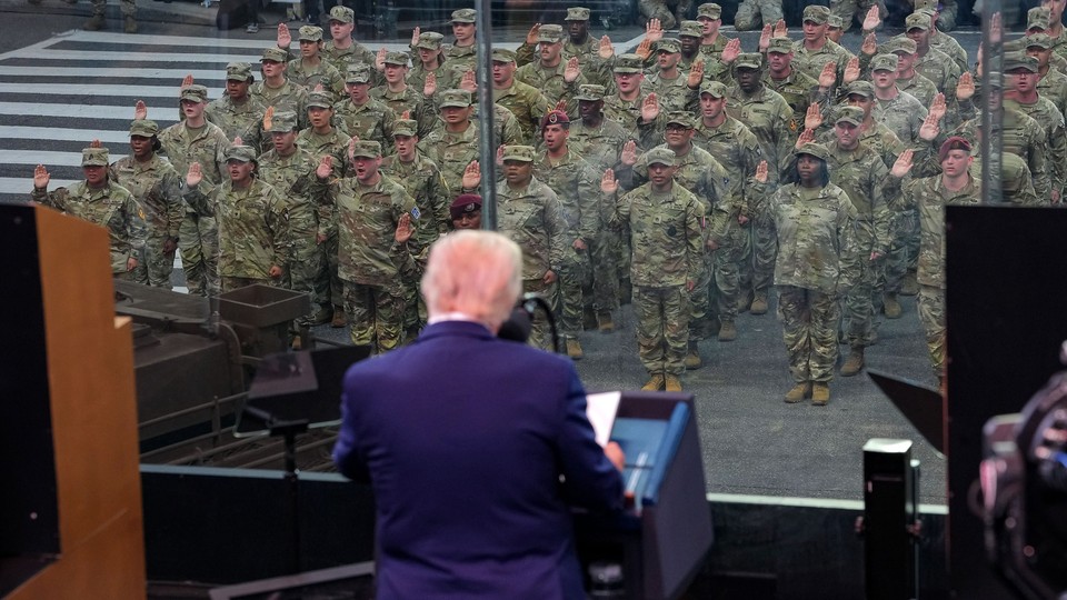 Trump and U.S. soldiers in the background