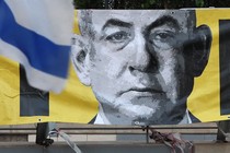 A stylized, pixelated image of Netanyahu is shown on a yellow banner, with a piece of an Israeli flag flying in the foreground