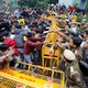 Police and protesters scuffle outside a university in New Delhi.