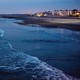 A day before the January 2018 king tide, waves break in front of condos along Imperial Beach's shoreline.