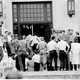 Black students are escorted through the front door of Central High School in Little Rock, Ark., Sept. 26, 1957. 