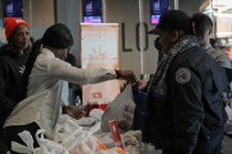 TSA workers line up at a food bank.