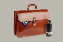 An illustration of a briefcase with a Trump sticker and a smoke canister