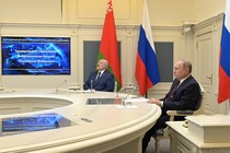 Russian President Vladimir Putin and Belarusian President Alexander Lukashenko sit together