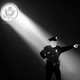 An illustration of a police officer with a spotlight on them.