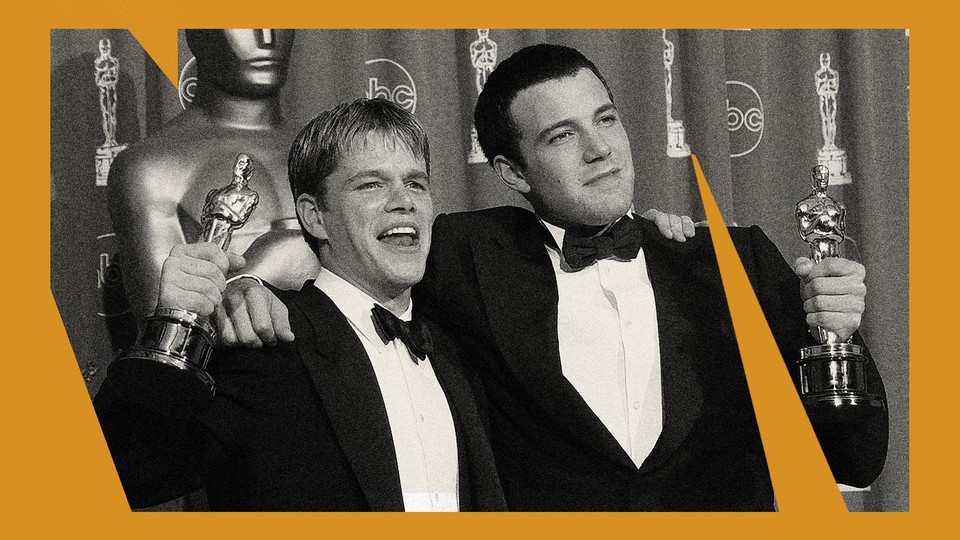 A black-and-white photo of Ben Affleck and Matt Damon in suits holding their Oscars for "Good Will Hunting."