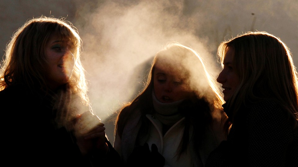 Three people gathered in the cold