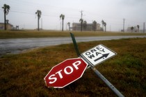 Street signs lie on the ground after winds from Hurricane Harvey intensified in Corpus Christi, Texas,