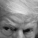 The upper half of President Trump's face, rendered in black and white