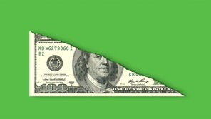A 100-dollar bill that has been torn in half diagonally