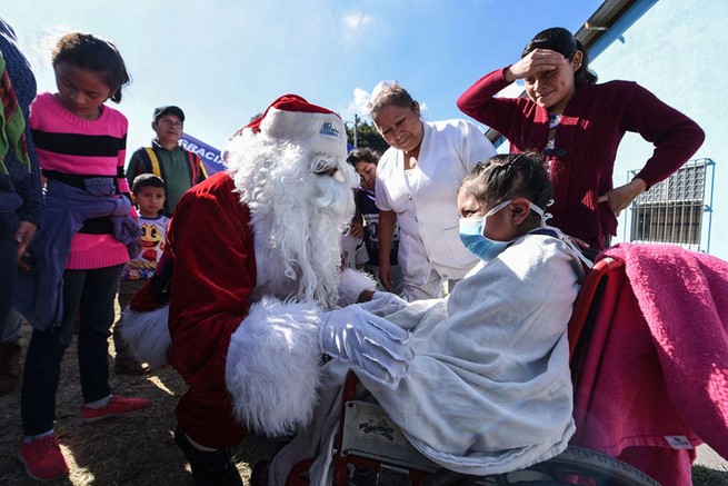 Santa Claus visits the San Juan de Dios Hospital in Guatemala City on December 19, 2018