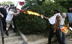 Corey Long sprays a makeshift flamethrower at white nationalist demonstrators