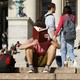 A person reads on a college campus