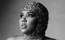 Black-and-white portrait of Lizzo in a sequined cap