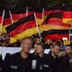 Right-wing activists hold German flags at a demonstration in Chemnitz in September.