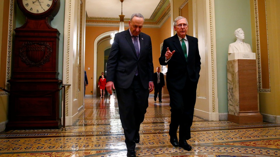 Senate Minority Leader Chuck Schumer and Senate Majority Leader Mitch McConnell walk to the chamber after collaborating on a budget agreement last week.