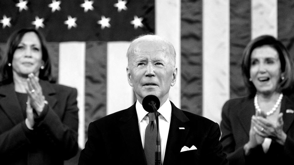 President Joe Biden is seen giving the State of the Union address with Kamala Harris and Nancy Pelosi in the background