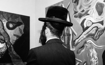 A man admiring art in a gallery