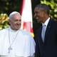 Pope Francis smiling, looking at smiling President Barack Obama