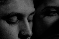 black-and-white close up of two faces next to each other