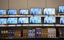 A photograph of rows of televisions in a Best Buy