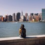 A young woman gazes at Manhattan's skyline