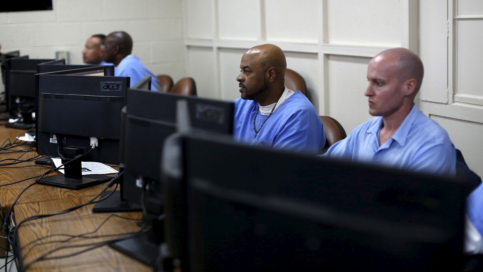 Inmates at work on computers at San Quentin