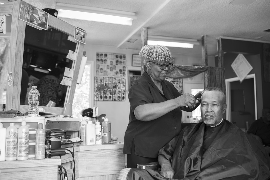 black and white image of Helen Young at her barbershop
