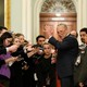 Chuck Schumer speaks to reporters in a hallway of the Capitol Building before entering the Senate chamber for the impeachment trial.