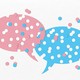 pink and blue speech balloons with holes punched in them
