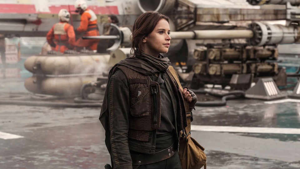 Felicity Jones as Jyn Erso wears a dark brown outfit in 'Rogue One'